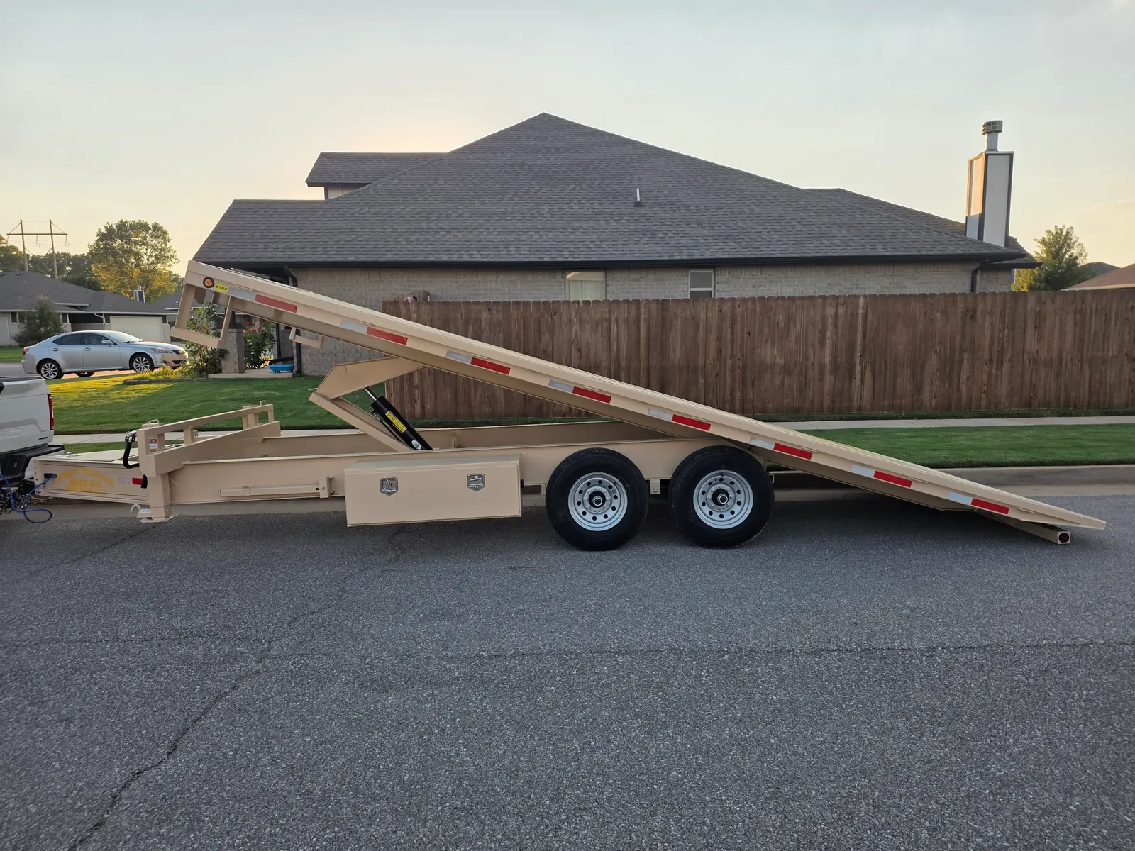 Tan deckover tilt trailer loading ramp rental Oklahoma